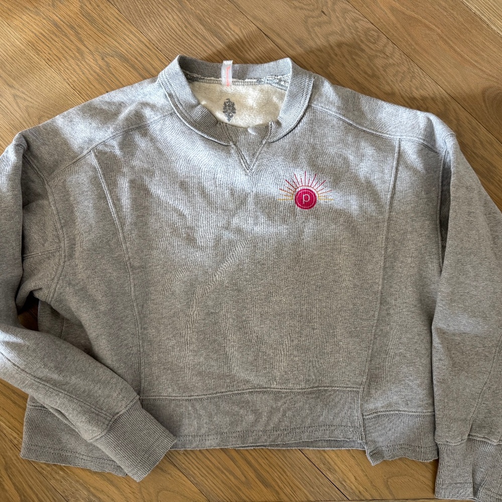 Gray Crewneck Sweatshirt with Pink Sun Emblem